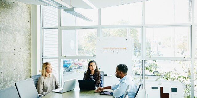 people sitting around a desk