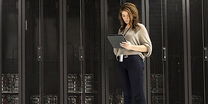 Businesswoman Using Tablet in Server Room
