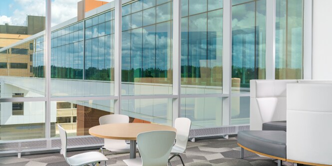 office space with a wall of windows
