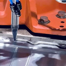 Close-up of the application of Sealant SZ1000 on a battery enclosure.