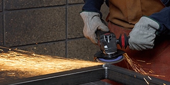 grinding weld removal on metal seam
