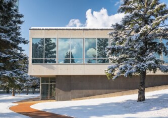 Exterior image of windowed building with snow
