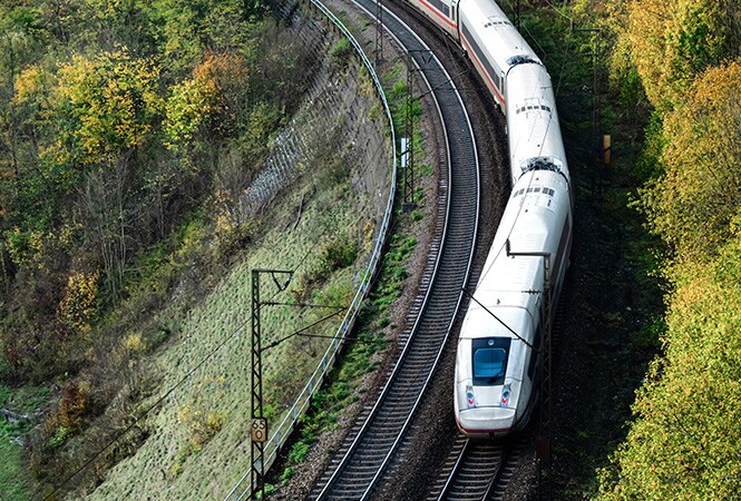Aerial view of busy multilane highway showing high heat exposure that 3M Cooling Film helps reduce for rail operations.
