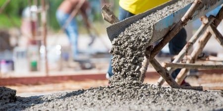 Wet cement coming from a chute
