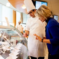 chef and manager examine a case in a restaurant environment