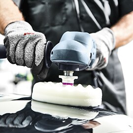 technicial using Perfect-It EX System on vehicle hood