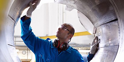 Aircraft engineer inspecting reverse thruster of 737
