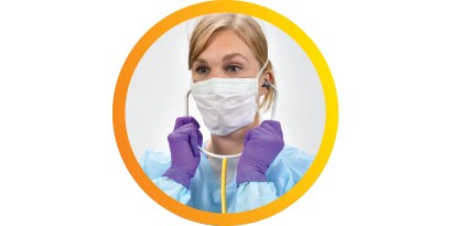 Single-patient disposable stethoscope's chestpiece held by a gloved hand
