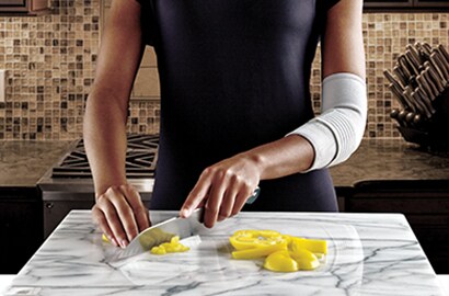 Person cutting vegetables.