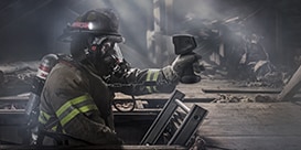 Firefighter wearing hands-free thermal imaging camera facepiece Scott Sight
