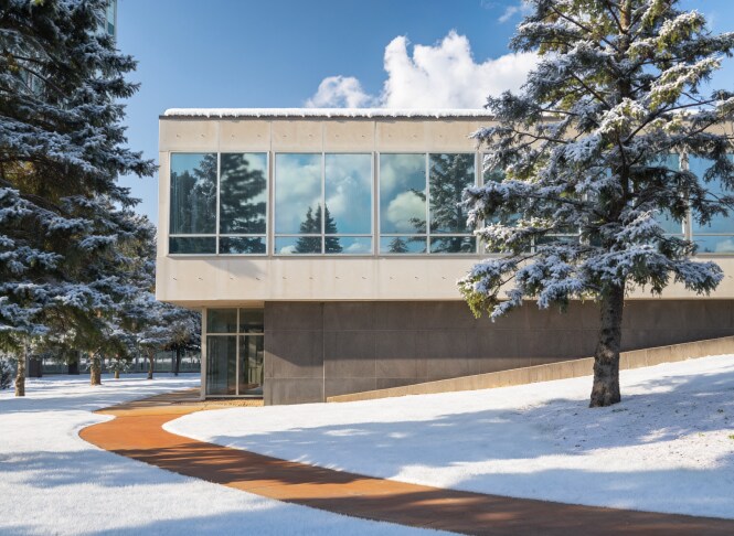 exterior image of windowed building with snow
