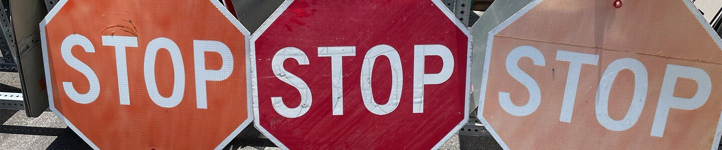 Stop sign comparison photo using 3M reflective pavement markings