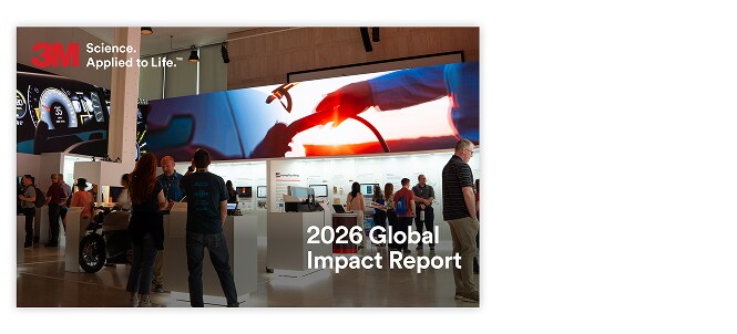 3M trade show booth with visitors viewing technology displays beneath a large screen.

