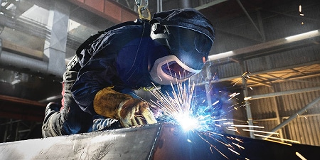 Welder welding with a speedglas helmet
