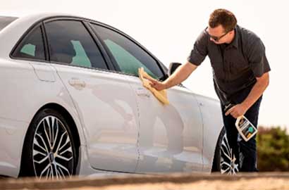 Man washing car with no water