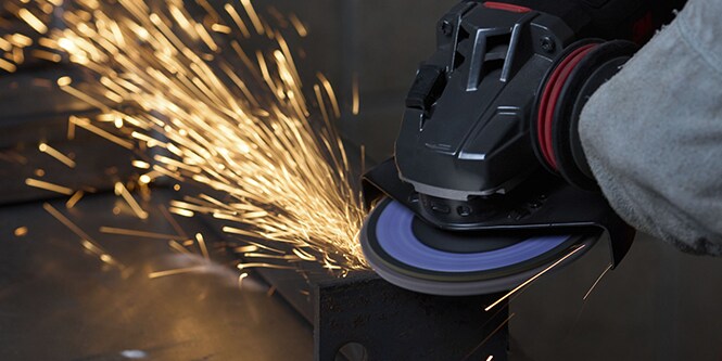 3M™ Cubitron™ Flap Disc grinding a metal part
