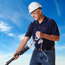 3M Electrician unwinds core from 3M medium voltage termination