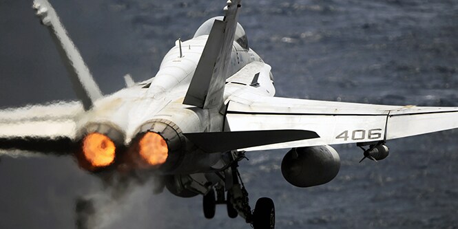 Small aircraft taking off on runway.
