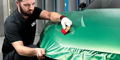 protection wrap film being applied with squeegee 