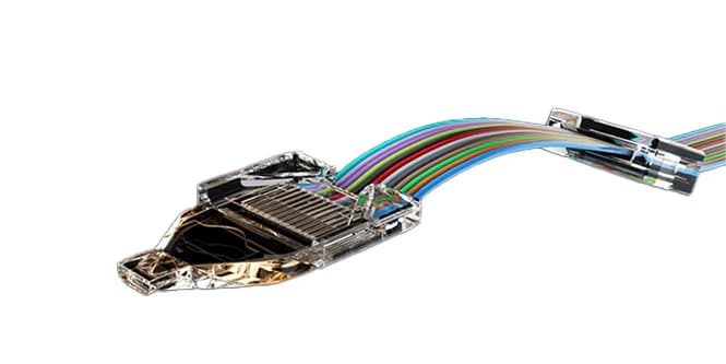 Close-up of 3M Expanded Beam Optical Ferrule with multiple colored wires, showcasing advanced design
