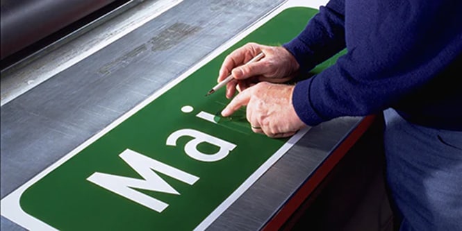 Traditional road sign being manufactured
