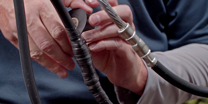 electrical splice being wrapped in 3M Super 88
