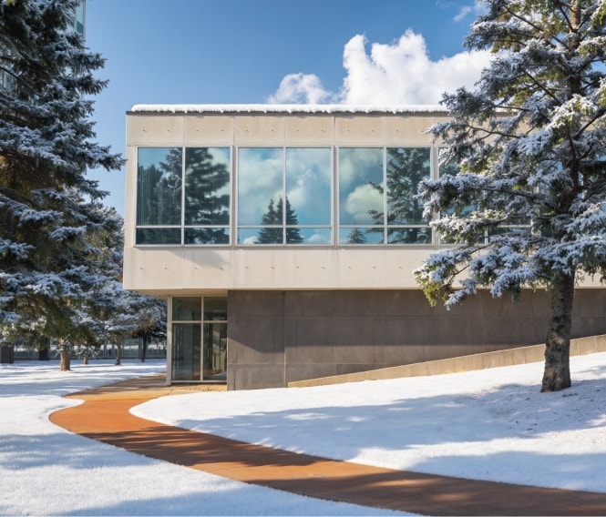 exterior image of windowed building with snow
