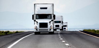 Trucking industry - three white semis
