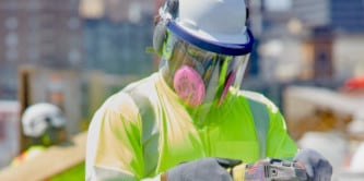 construction worker wearing reusable respirator

