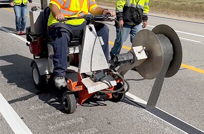 715IR black tape application on white pavement marking
