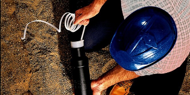 worker installing cold shrink splice on electrical cable

