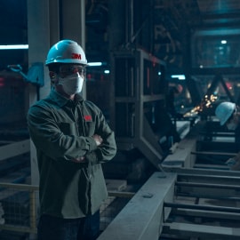 Man using a 3M Aura Respirator