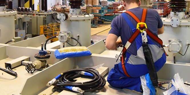 worker installing electrical cables
