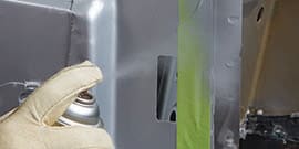 applying weld-through primer to future weld site
