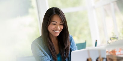 A woman enjoying a brightly lit room
