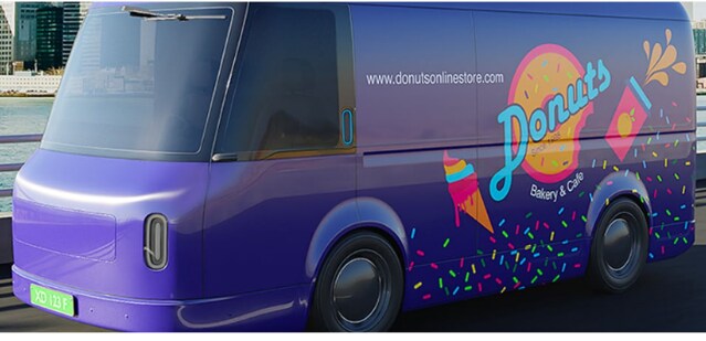 Purple delivery van wrapped in colorful 3M graphics for a donut bakery brand.
