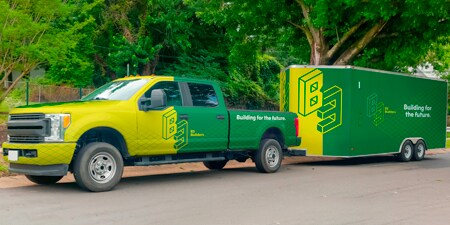 truck with attached trailer showcasing gloass overlaminate vehicle and trailer wrap
