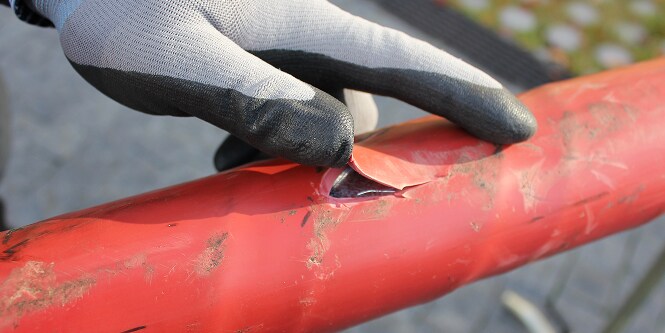 worker inspecting cut in electrical cable
