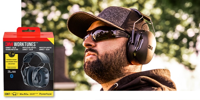 A man with a baseball cap and sunglasses wearing 3M™ WorkTunes™ Connect + Solar Hearing Protector outdoors.
