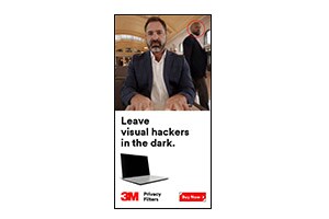 This is the 3M&trade; Visual Hacking campaign, featuring a static banner asset, showing Travel and Remote Work, with a 'Buy Now' call-to-action, for en_US-speaking audiences, with dimensions of 300x600, available in jpg format (25V01).