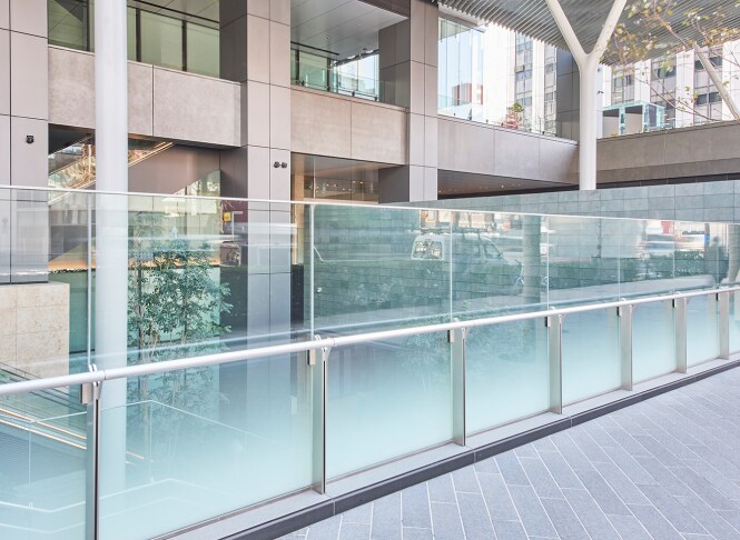 glass railing with decorative iatve glass finish applied
