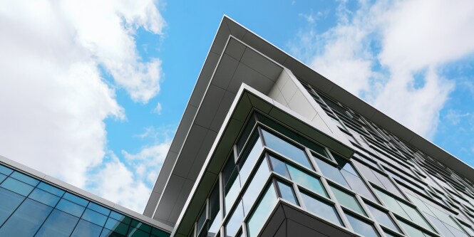 the exterior of a windowed building 
