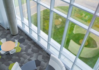 above view of open space with floor to ceiling windows
