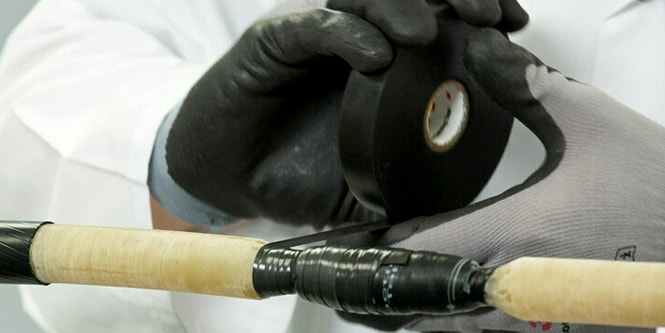 electrical cable being wrapped in primary insulation
