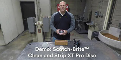 image of person standing at a workbench
