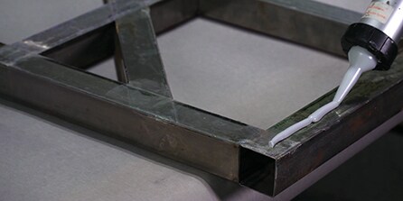 application of attaching material
