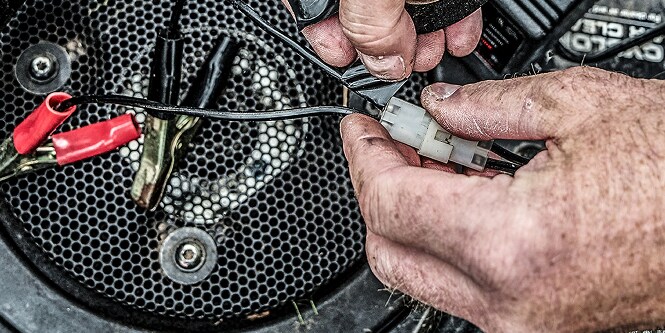 harnessing engine cables with electrical tape
