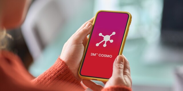 hand holding phone using COSMO app