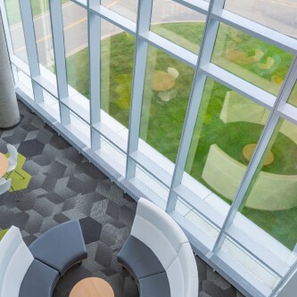 above view of open space with floor to ceiling windows
