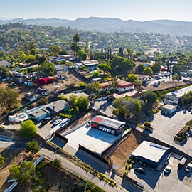 Aerial view of a neighborhood with a 3M Pro Shop location, illustrating dealer territory protection.